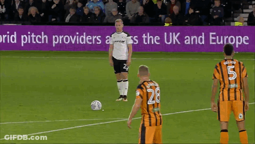A Soccer Game Is Being Played In Front Of A Sign That Says ' Pitch Providers Across The Uk And Europe ' GIF