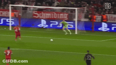 A Soccer Game Is Being Played In Front Of A Sign That Says Schmidting GIF