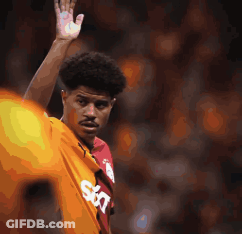 A Soccer Game Is Being Played In Front Of A Sign That Says Vakif GIF