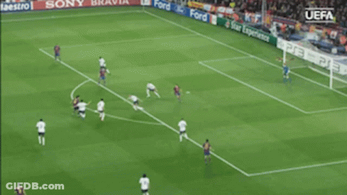 A Soccer Game Is Being Played In Front Of A Uefa Banner GIF