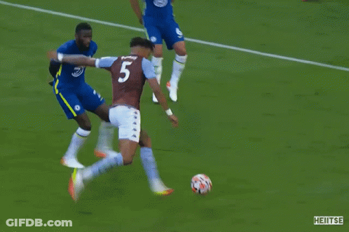A Soccer Game Is Being Played In Front Of A Yokohama Ad GIF
