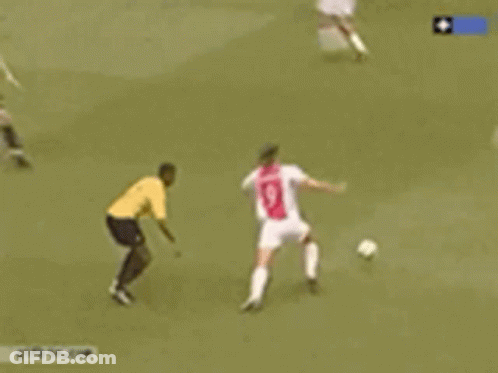 A Soccer Game Is Being Played In Front Of An Ad For Energie GIF