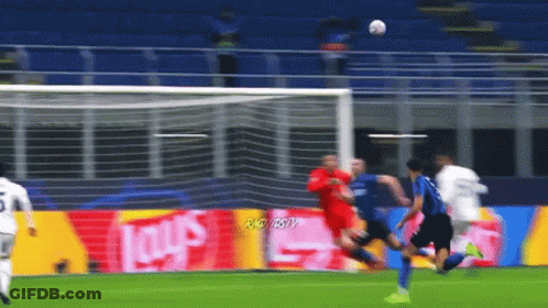 A Soccer Game Is Being Played In Front Of An Ad For Lays Chips GIF