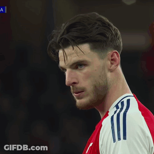 A Soccer Game Is Being Played In Front Of An Ad For Ps5 GIF