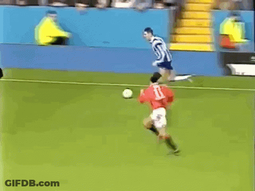 A Soccer Game Is Being Played In Front Of An Advertisement For Hicks Sport Shoes GIF