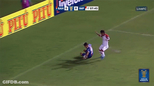 A Soccer Game Is Being Played In Front Of An Advertisement For Pitu Pitu GIF