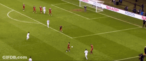 A Soccer Game Is Being Played On A Field That Is Sponsored By Sharp GIF