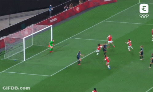 A Soccer Game Is Being Played On A Field That Says Tokyo 2020 GIF