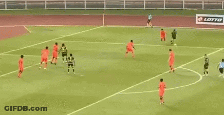 A Soccer Game Is Being Played On A Field With A Banner Behind The Goal That Says Bell GIF