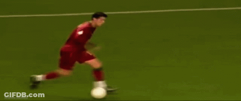 A Soccer Game Is Being Played On A Field With A Banner That Says Kmn GIF