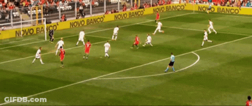 A Soccer Game Is Being Played On A Field With A Banner That Says Novo Banco GIF