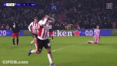 A Soccer Game Is Being Played On A Field With A Heineken Sign In The Background GIF