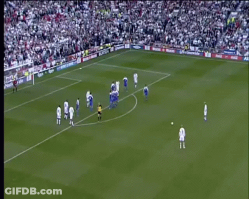 A Soccer Game Is Being Played On A Field With A Large Crowd Watching . GIF