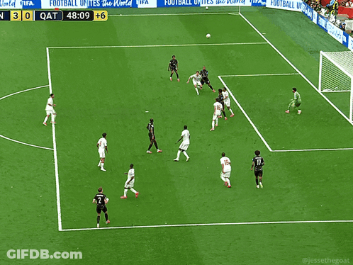 A Soccer Game Is Being Played On A Field With A Sign That Says Fifa GIF