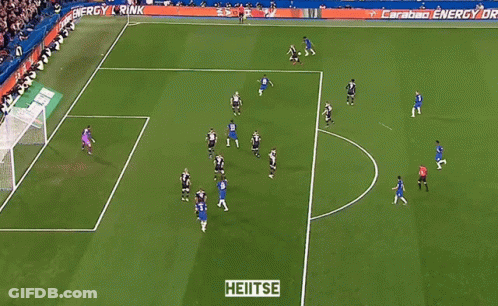 A Soccer Game Is Being Played On A Field With A Sign That Says Heitse GIF