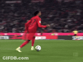 A Soccer Game Is Being Played On A Field With A Sign That Says Meten GIF