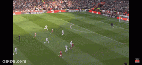 A Soccer Game Is Being Played On A Field With Absolute Touch Advertisements On The Sidelines GIF