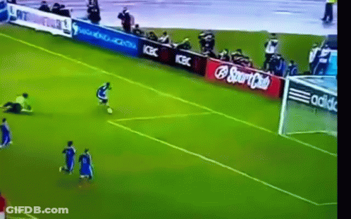 A Soccer Game Is Being Played On A Field With Ads For Coca Cola And Adidas GIF
