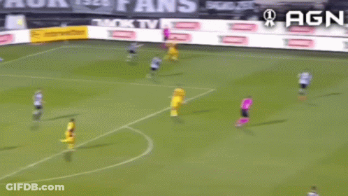 A Soccer Game Is Being Played On A Field With Advertisements For Agn In The Background GIF