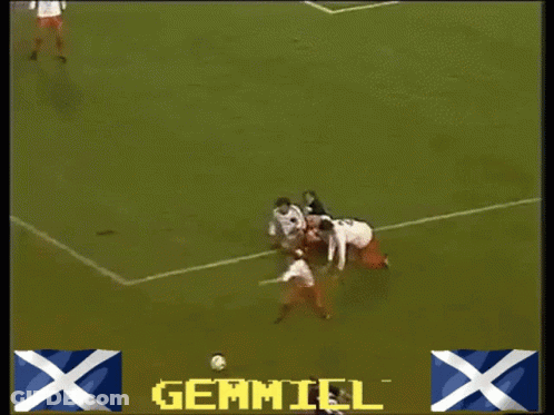 A Soccer Game Is Being Played On A Field With Advertisements For Gillette Mothercare And Guinness GIF
