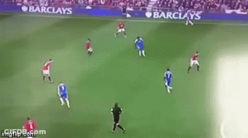 A Soccer Game Is Being Played On A Field With Barclay 'S Advertisements On The Sidelines . GIF