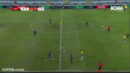 A Soccer Game Is Being Played On A Field With Coca-Cola Advertisements On The Sidelines GIF