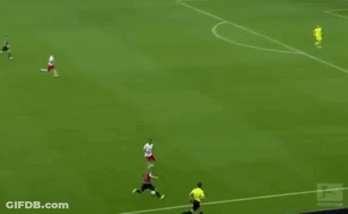 A Soccer Game Is Being Played On A Field With Red Bull Advertisements On The Sidelines GIF
