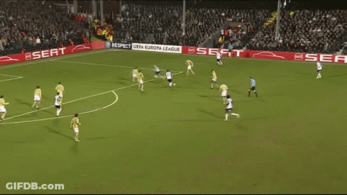 A Soccer Game Is Being Played On A Field With Seat Advertisements On The Sidelines GIF