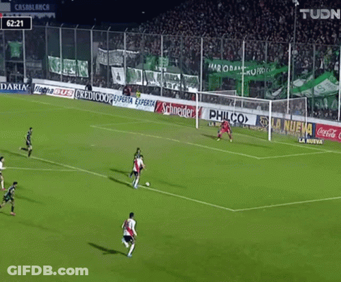A Soccer Game Is Being Played With Ads For Philco And Coca Cola On The Sidelines GIF
