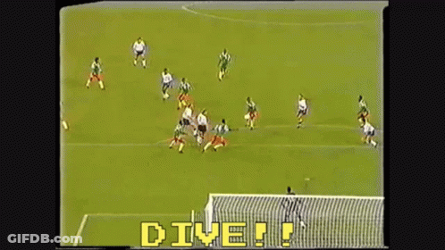 A Soccer Game Is Being Played With The Words " Dive " In Yellow Letters GIF