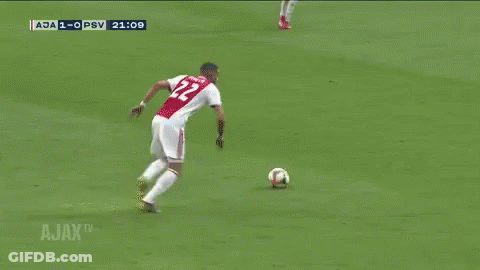A Soccer Goalie Is Diving To Catch A Ball During A Match Between Ajax And Psv GIF