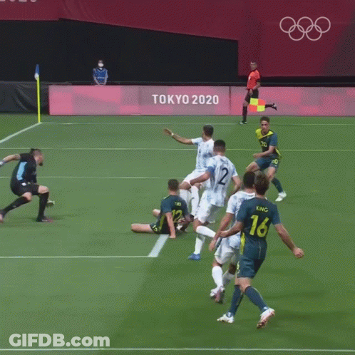 A Soccer Goalie Is Laying On The Field In Front Of A Sign For Fifa GIF