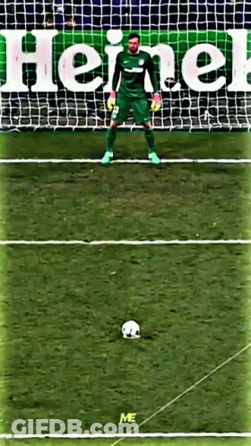 A Soccer Goalie Stands In Front Of A Heineken Advertisement GIF