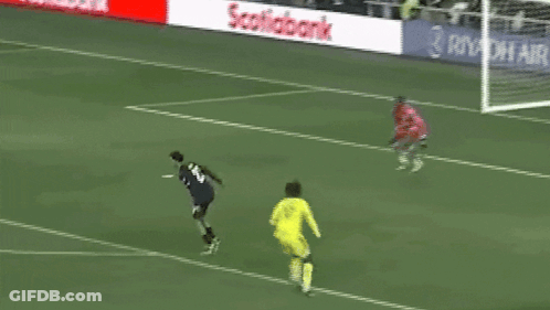 A Soccer Goalie Stands In Front Of A Lowe 'S Sign GIF