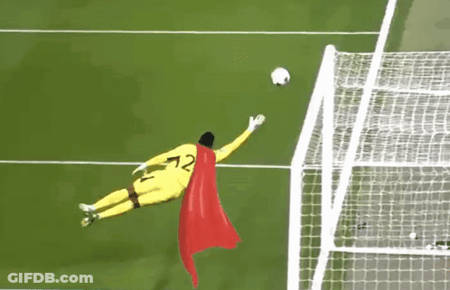 A Soccer Goalie Wearing A Cape And The Number 72 Jumps To Catch A Soccer Ball GIF