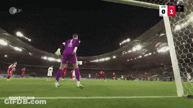 A Soccer Goalie With The Number 1 On His Jersey Jumps To Catch A Ball GIF