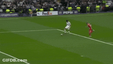 A Soccer Goalie With The Number 1 On His Shirt Is Diving To Catch A Soccer Ball . GIF