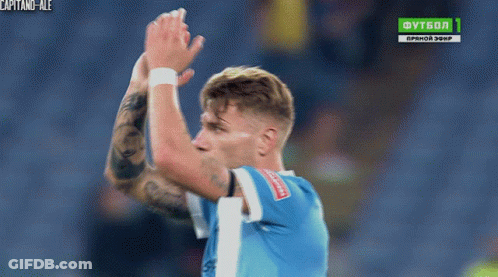 A Soccer Player Applauds In Front Of A Tv Screen That Says Futbol 1 GIF