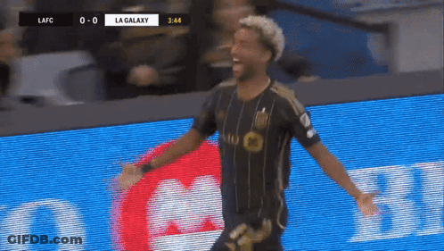 A Soccer Player Celebrates A Goal In Front Of A Scoreboard That Says La Galaxy GIF