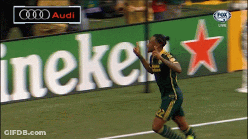 A Soccer Player Celebrates A Goal In Front Of An Audi And Heineken Sign GIF