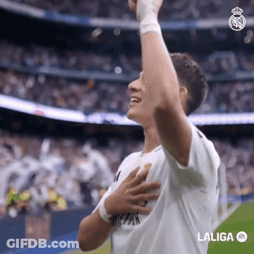 A Soccer Player Celebrates A Goal With His Hands In The Air Sponsored By Laliga GIF