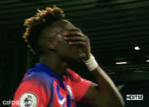 A Soccer Player Covering His Mouth With His Hand And The Word Heitse Is On The Bottom Right GIF
