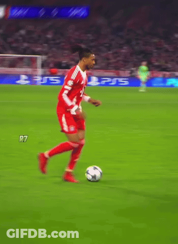 A Soccer Player Dribbles A Ball On A Field With A Ps5 Advertisement In The Background GIF
