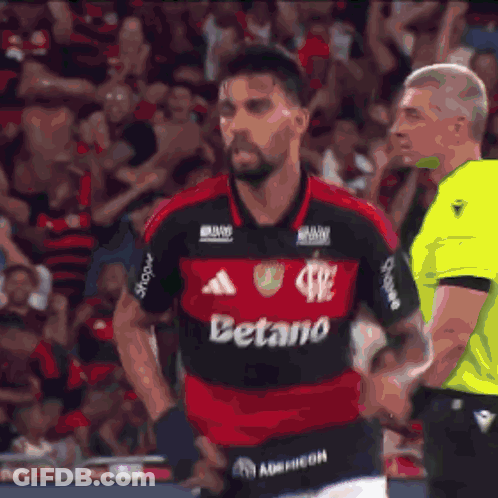 A Soccer Player Giving A Thumbs Up In Front Of A Scoreboard That Has The Number 2 On It GIF
