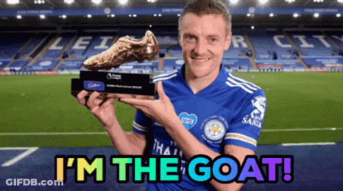 A Soccer Player Holding A Trophy With The Words I 'M The Goat Below Him GIF