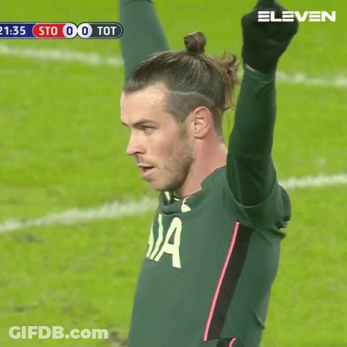 A Soccer Player In A Aia Jersey Holds Up His Arm In The Air GIF