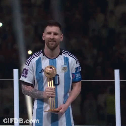 A Soccer Player In A Blue And White Striped Jersey Holds A Trophy GIF