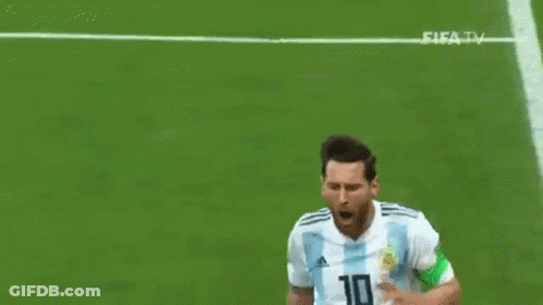 A Soccer Player In A Blue And White Striped Shirt Is Kneeling On The Field With His Arms Outstretched . GIF