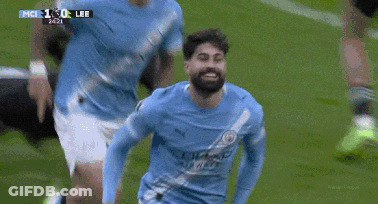A Soccer Player In A Blue Jersey Is Celebrating A Goal During A Game GIF