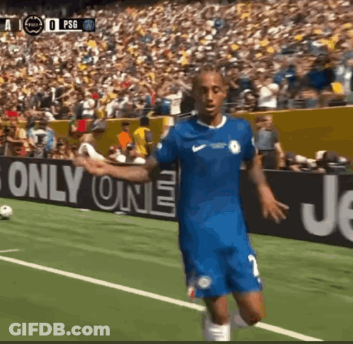 A Soccer Player In A Blue Jersey Stands On A Field In Front Of A Sign That Says " Only One " GIF